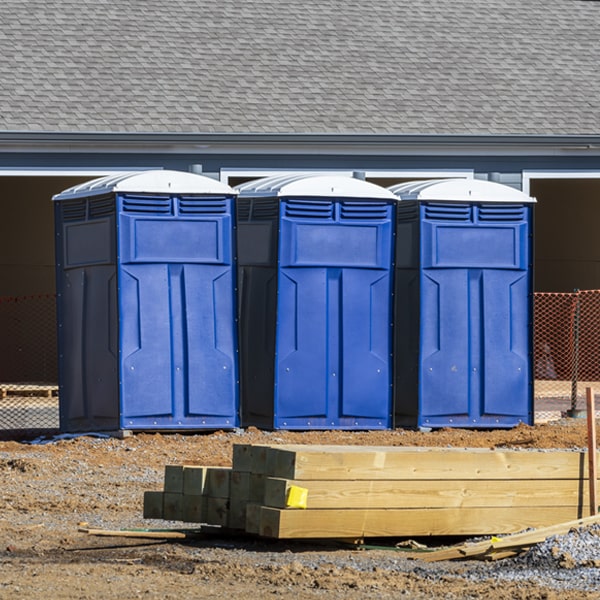 what is the cost difference between standard and deluxe porta potty rentals in Tumacacori